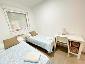 Łóżko lub łóżka w pokoju w obiekcie HOSPEDAJE LA PAZ