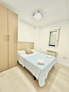 Łóżko lub łóżka w pokoju w obiekcie HOSPEDAJE LA PAZ