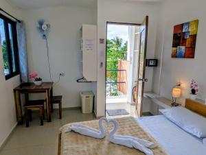 Postel nebo postele na pokoji v ubytování Astillo's Guest Houses + 16 fotografií