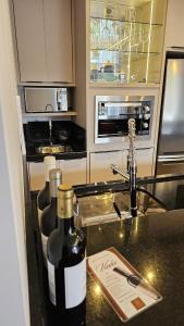 a kitchen with two bottles of wine on a counter at Studio Pomerode in Pomerode