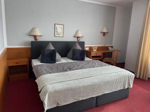Ένα ή περισσότερα κρεβάτια σε δωμάτιο στο Hotel Blocksberg
