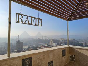 a view of the pyramids from the top of a building at Rafif hotel in Cairo