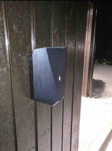 a blue box on the side of a building at New big cabin near the city centre! in Røros