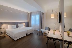 Ένα ή περισσότερα κρεβάτια σε δωμάτιο στο NH Roma Villa Carpegna