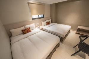 Postel nebo postele na pokoji v ubytování Golden Stone Hotel