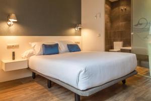 Postel nebo postele na pokoji v ubytování Hotel Andia