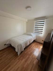 Ένα ή περισσότερα κρεβάτια σε δωμάτιο στο Hospedaje en viña del mar