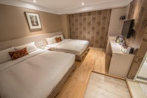 Postel nebo postele na pokoji v ubytování Golden Stone Hotel