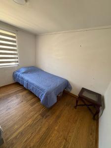 Ένα ή περισσότερα κρεβάτια σε δωμάτιο στο Hospedaje en viña del mar +5 φωτογραφίες