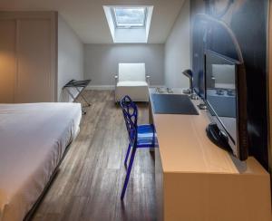TV a/nebo společenská místnost v ubytování Hotel Andia