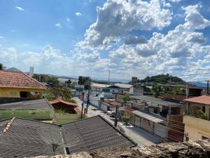 arial view of a city with buildings and a cloudy sky at Recanto Remanso in Queimados
