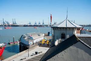a dock with a boat in a body of water at lookout in Harwich