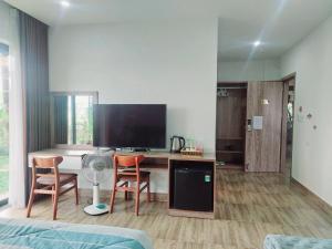 TV a/nebo společenská místnost v ubytování An Villa Beach Paradise