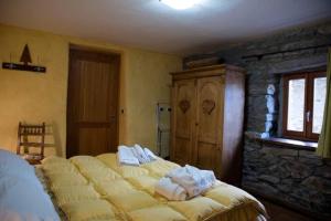 Postel nebo postele na pokoji v ubytování Appartamento Margherita a Montjovet