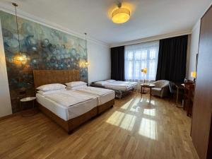 Letto o letti in una camera di Hotel Secession an der Oper