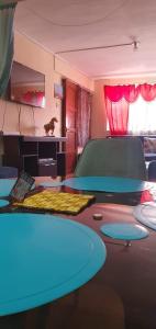 a room with a table with blue lights on it at Mi casa tu casa. My house in La Paz