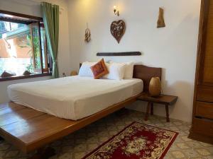 Postel nebo postele na pokoji v ubytování Nanu beach house Hội an + 90 fotografií