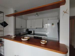 a kitchen with two bowls on a wooden counter at Sa Carola in Cadaqués
