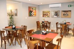 a restaurant with tables and chairs in a room at HOTEL CORTESE in Teresina