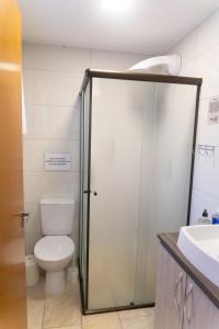 a bathroom with a toilet and a shower stall at Pousada Chalés do Vale - Vale dos Vinhedos in Bento Gonçalves +134 photos