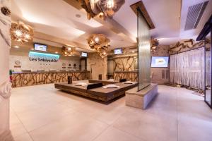 a large room with a large bed in the middle at Camping Sable d'Or 3 chambres in Cap d'Agde