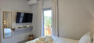 Ένα ή περισσότερα κρεβάτια σε δωμάτιο στο Perivleptos Ι