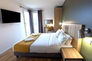 Letto o letti in una camera di Hôtel Lodge In Paris 13