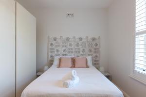 Ένα ή περισσότερα κρεβάτια σε δωμάτιο στο Newtown Terrace House Oasis