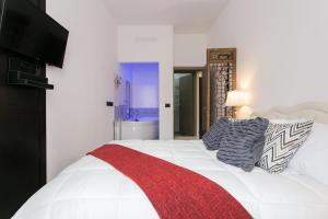 Postel nebo postele na pokoji v ubytování Aparthotel Dei Mercanti
