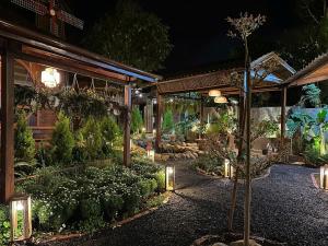 a garden at night with lights and plants at Kim Đồng Riverside in Trại Lê Lai