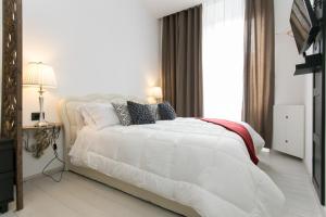 Postel nebo postele na pokoji v ubytování Aparthotel Dei Mercanti