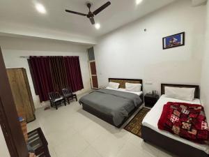 Letto o letti in una camera di Hotel Shree Ram