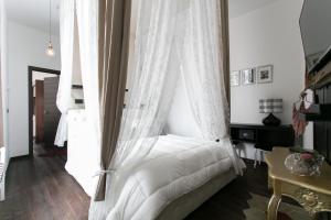 Postel nebo postele na pokoji v ubytování Aparthotel Dei Mercanti
