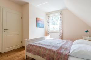 Ένα ή περισσότερα κρεβάτια σε δωμάτιο στο Hus in Luv