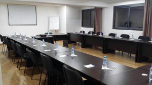 a large meeting room with a long table and chairs at Hôtel Teranga & Spa in Marrakesh +30 photos