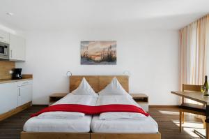 Ein Bett oder Betten in einem Zimmer der Unterkunft Gästehaus D i c k r e i t e r