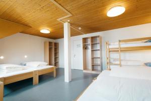 Postel nebo postele na pokoji v ubytování Schwendihaus Apartment + 20 fotografií