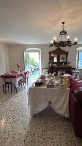 a dining room with a table with food on it at B&B Baldì in Pertica Alta