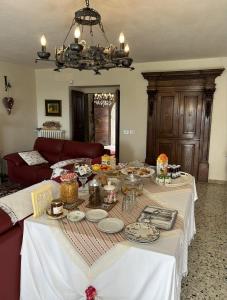 a living room with a table with food on it at B&B Baldì in Pertica Alta