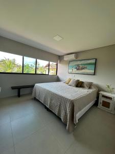 Giường trong phòng chung tại Casa16 Reserva dos Carneiros