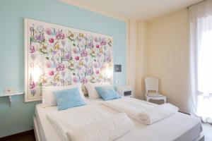 Postel nebo postele na pokoji v ubytování Hotel Speranza