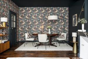 a dining room with a table and chairs at Séjours Maison Baluchon in Chaumont