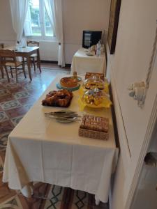 a white table with food on top of it at B&B Don Antonio in Civitella Casanova