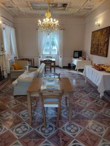 a living room with a couch and a table at B&B Don Antonio in Civitella Casanova