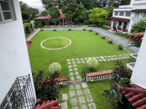 an aerial view of a yard with a basketball hoop at MiraNamin Nest SAMPAGUITA Suite - Balconies, Garden View, Pet Friendly with a Fee in Manila +19 photos