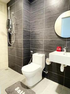 a bathroom with a toilet and a sink at Holiday like a King and Queen Close to KLIA2 FREE GIFT in Kampong Melot