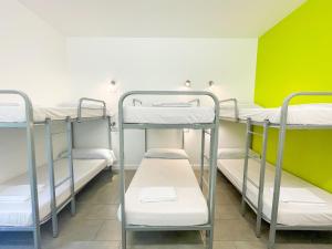 Postel nebo postele na pokoji v ubytování UBA Hostel