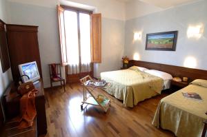 TV a/nebo společenská místnost v ubytování Hotel Palazzo Vecchio