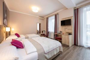 Postel nebo postele na pokoji v ubytování HOTEL junior by MAX 70