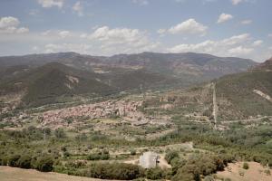 an aerial view of a town in the mountains at Cal Portalé - Casa de Pagès in Claverol